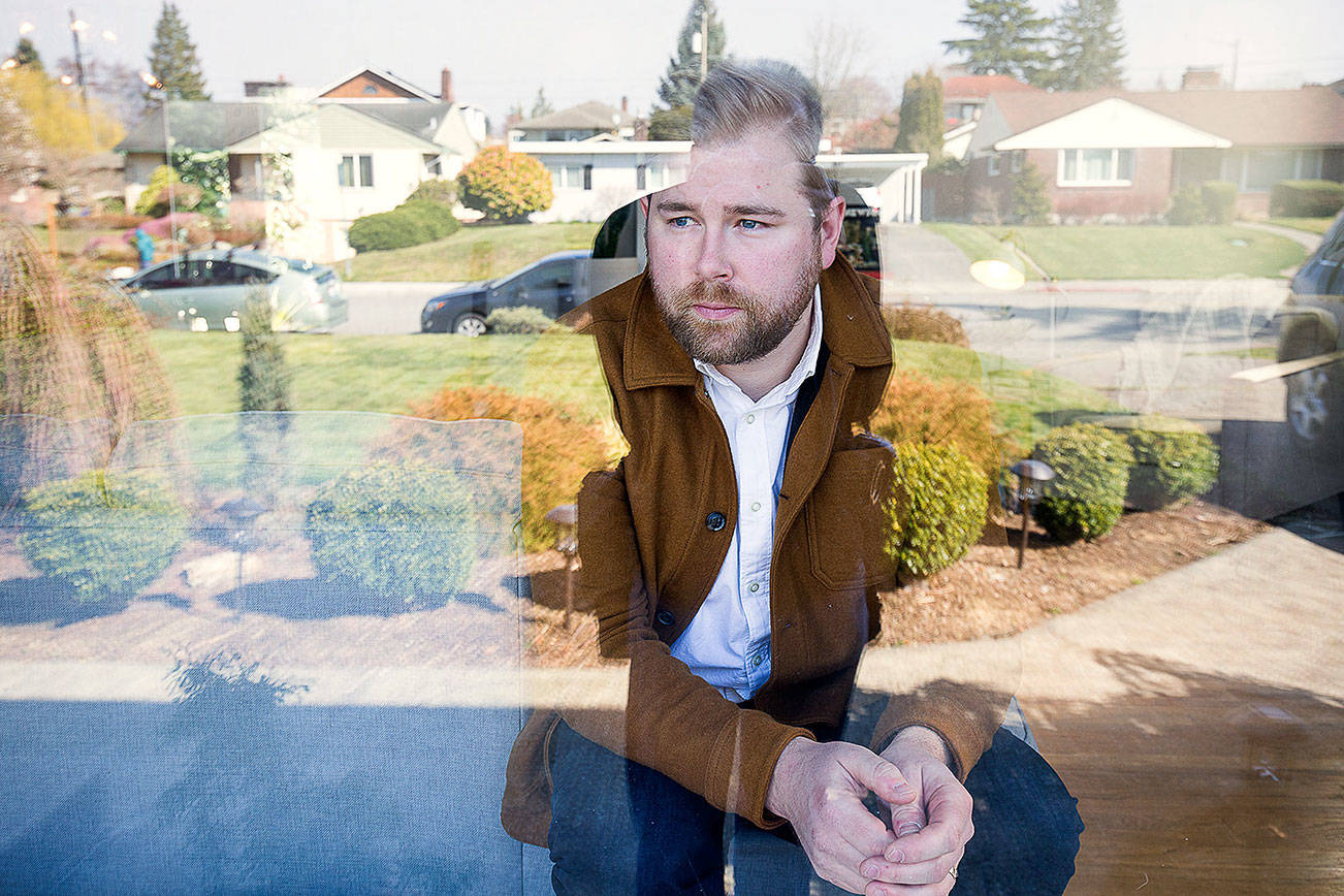 Tyler Chism was diagnosed with COVID-19 and is currently cleared, by CDC standards, but chooses to remain indoors at home on March 20 in Everett. (Andy Bronson / The Herald)